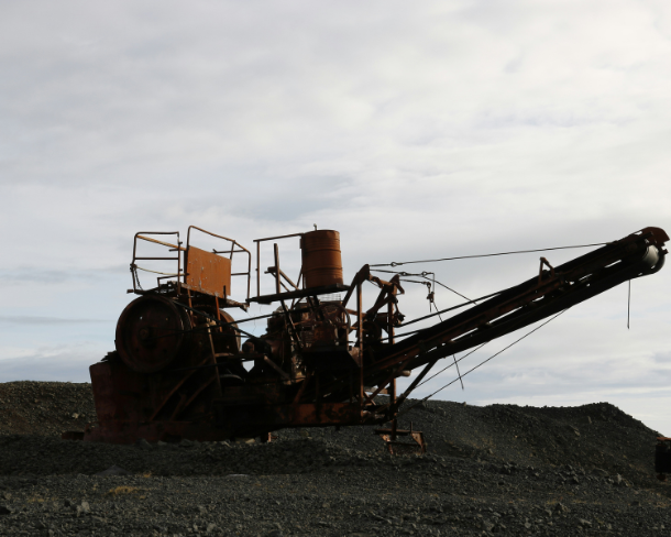 Heavy machinery operating in a mining environment.