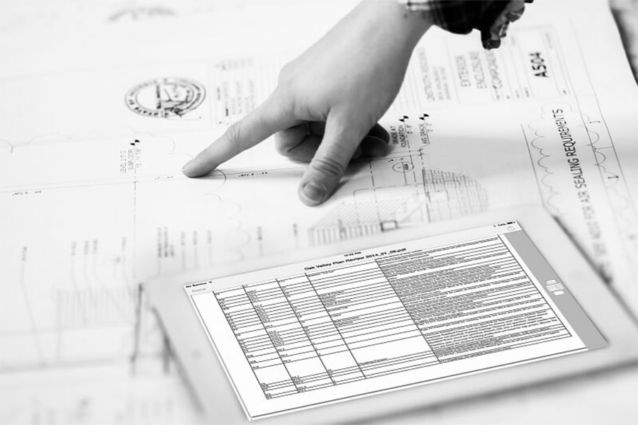 3rd Party Design Review: Hand points to architectural plans and a digital review document.