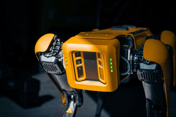 Beyond the Naked Eye: How Predictive Maintenance Is Redefining Structural Safety Yenem Structural Engineers Yellow robotic dog with advanced sensors, used for predictive maintenance and structural safety inspections.