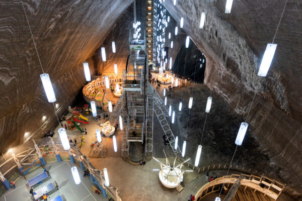 Structural compliance check in underground industrial facility with conveyor and access systems.