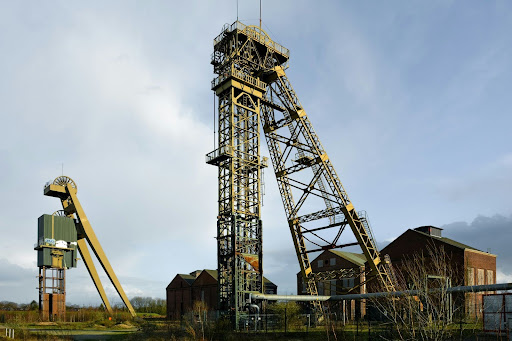 Heavy-duty crane positioned in an industrial mining structures.